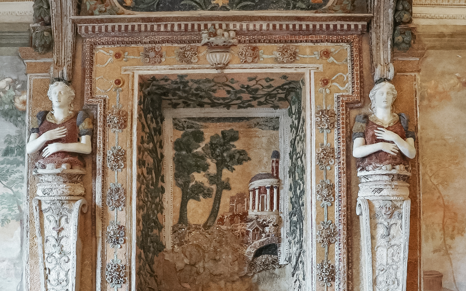 Villa d'Este wall art depicting intricate frescoes and classical motifs in Tivoli, Italy.