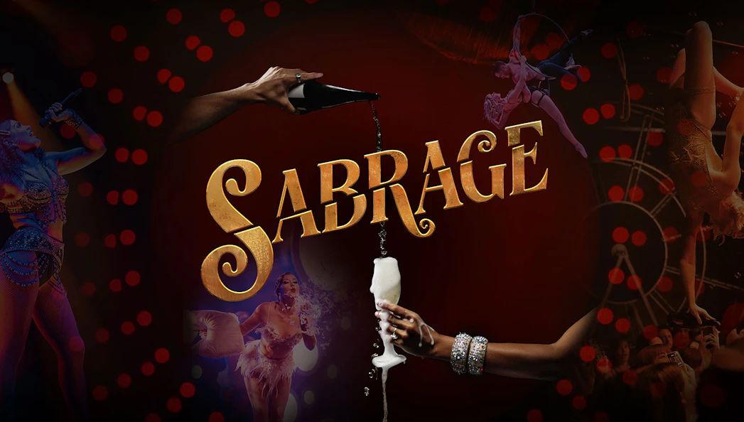 Sabrage event with champagne pouring and performers in vibrant costumes.