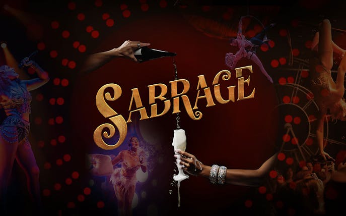 Sabrage event with champagne pouring and performers in vibrant costumes.