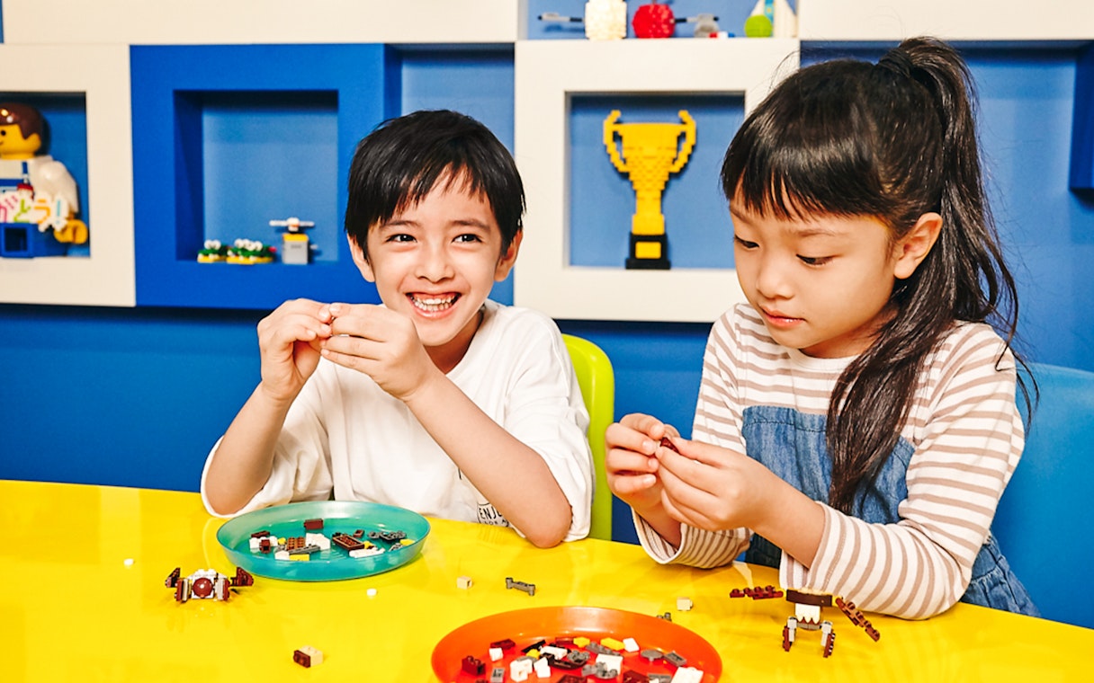 Children building with LEGO at LEGOLAND Discovery Center Tokyo.
