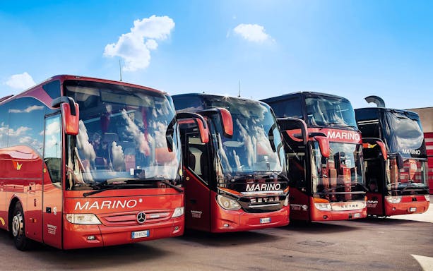 MarinoBus coaches parked, offering one-way tickets between Naples Metropark and Rome Tiburtina.