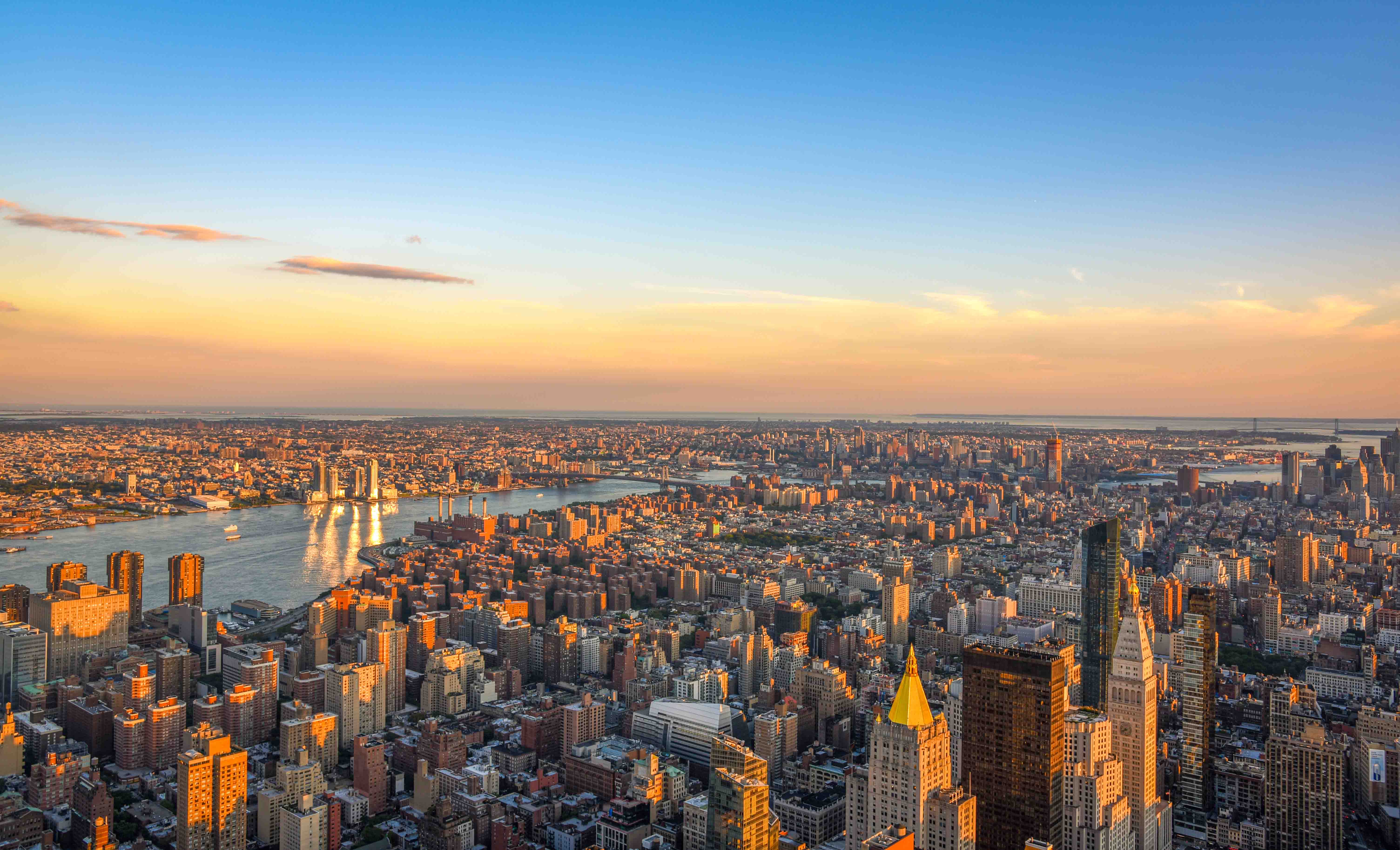 Empire State Building view from observation deck overlooking New York City skyline.