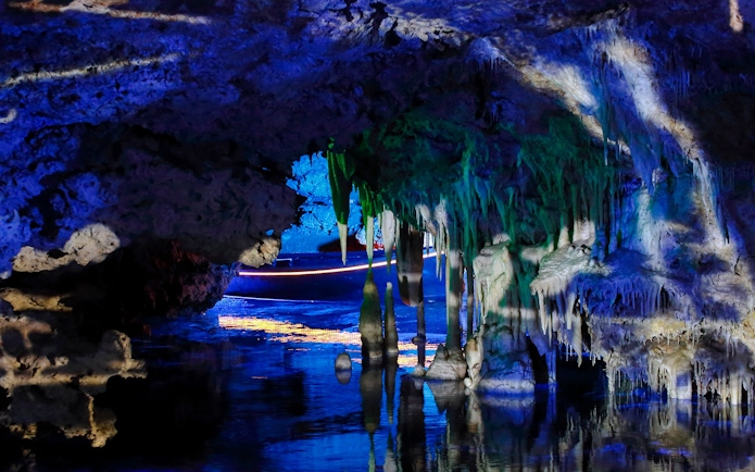 Stalactites and stalagmites in illuminated Hams Caves, Mallorca.