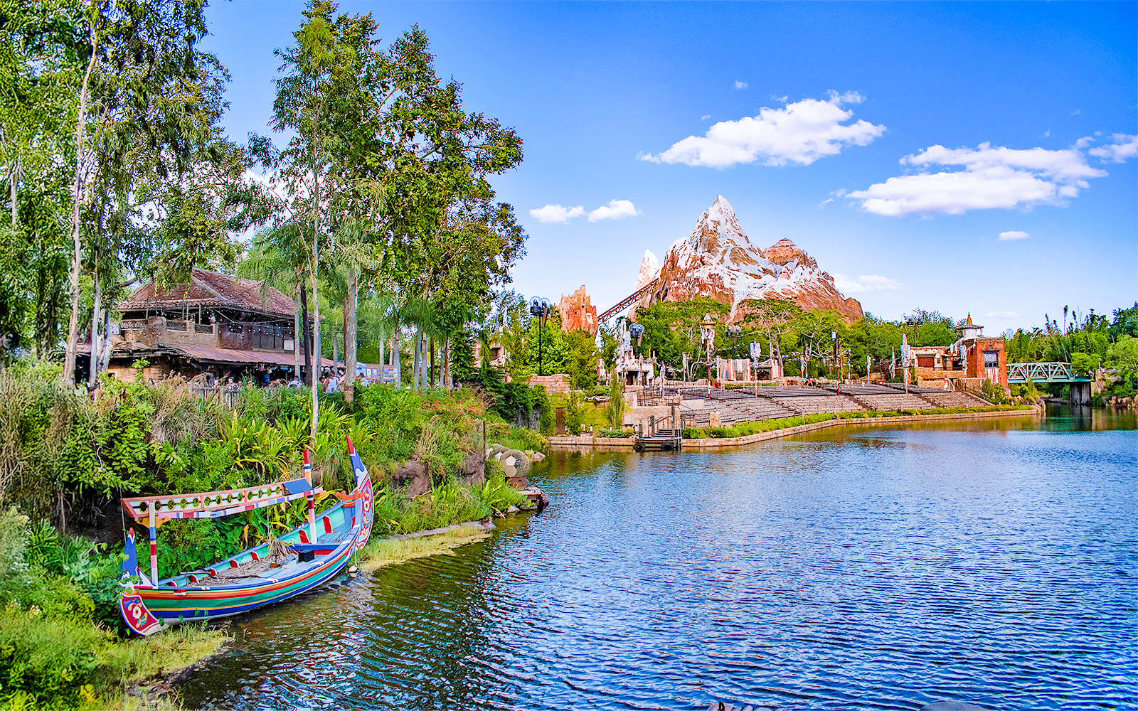 Expedition Everest mountain and colorful boat on the water in Frontierland, Walt Disney World, Orlando.