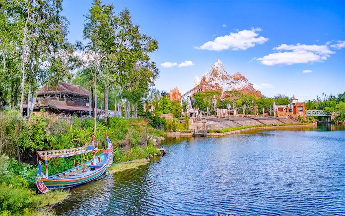 Expedition Everest mountain and colorful boat on the water in Frontierland, Walt Disney World, Orlando.