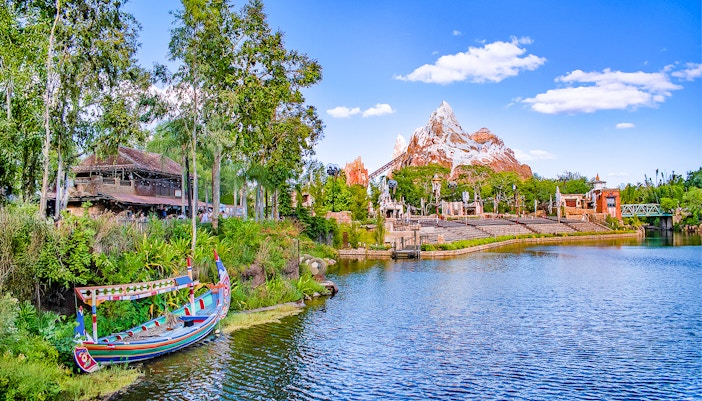 Expedition Everest mountain and colorful boat on the water in Frontierland, Walt Disney World, Orlando.