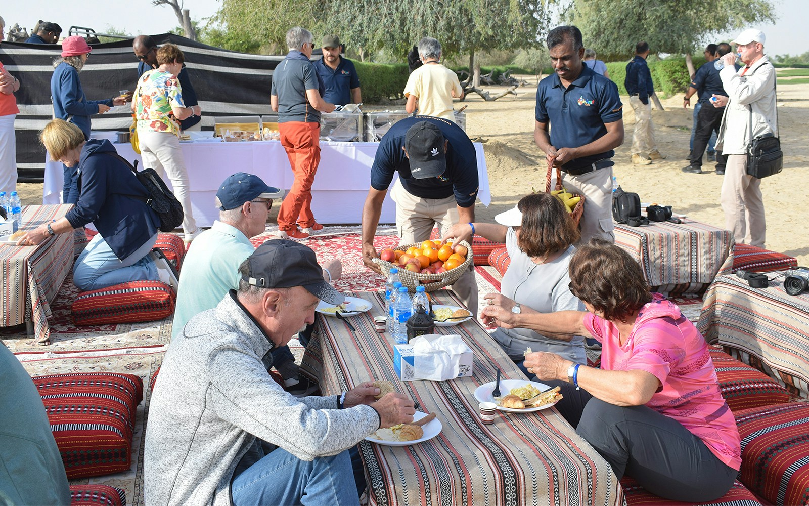 Guests enjoying breakfast during a Sunrise Morning Desert Safari.
