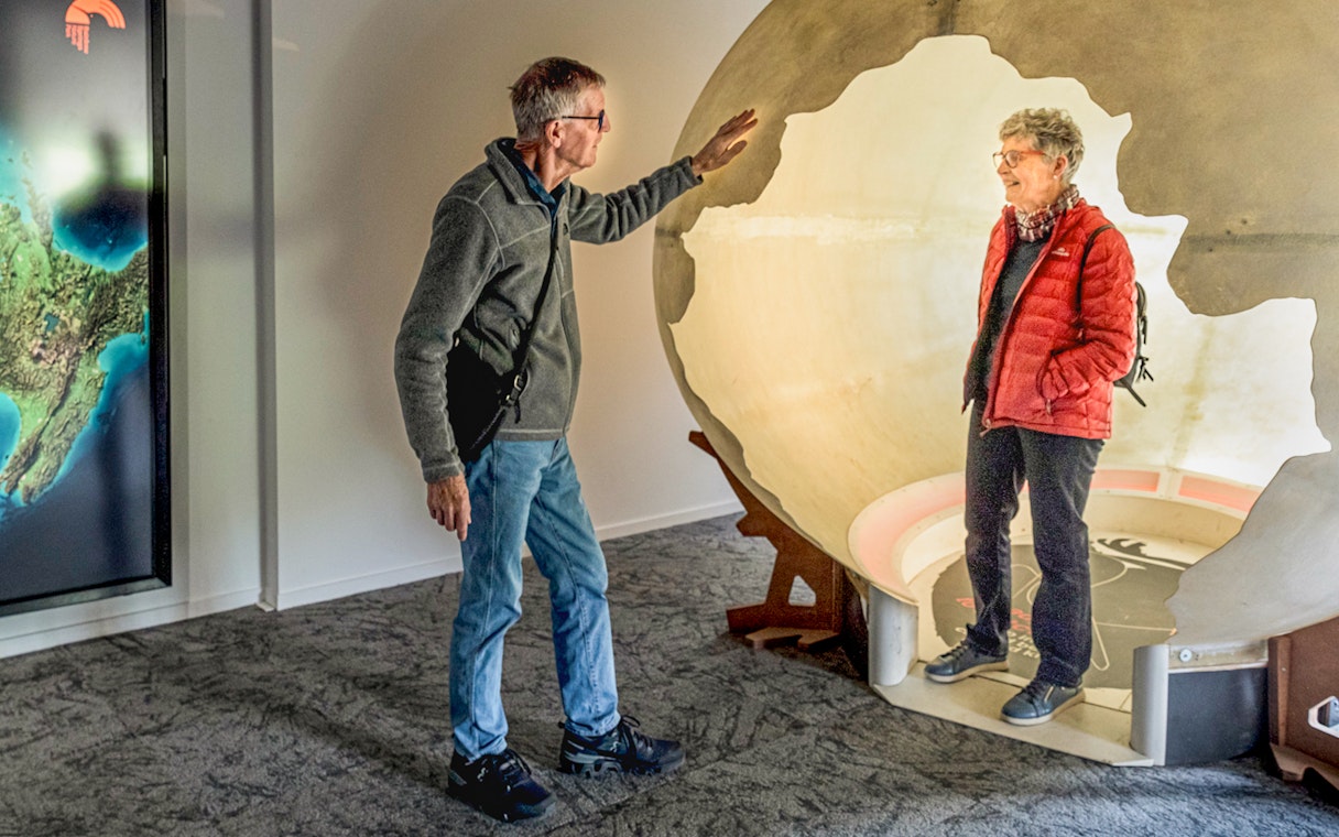 Interactive demo at The National Kiwi Hatchery Tour with a person inside a large egg model.