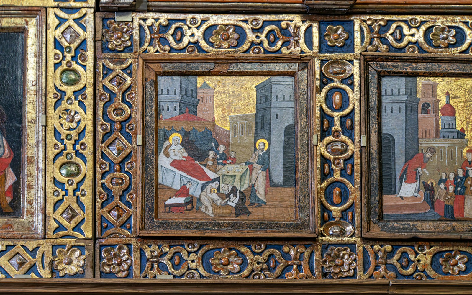 Iconostasis panel depicting religious scene in an Orthodox church with ornate gold detailing.