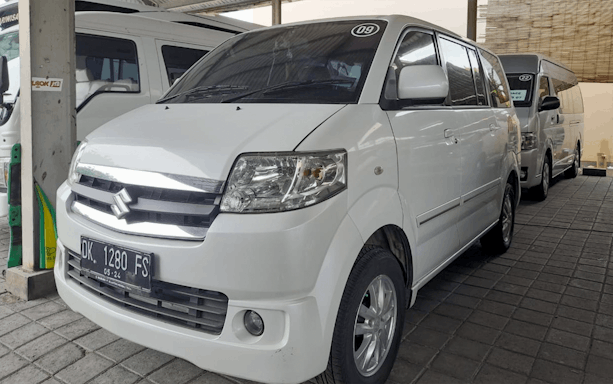 White van for shared airport transfers from Bali International Airport.