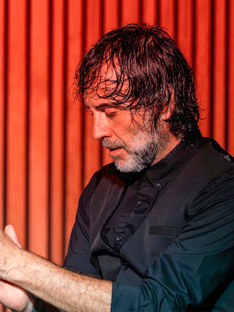 Performer clapping during a flamenco show at La Perla del Born, Barcelona.