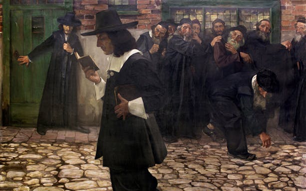 Philosopher walking past a group of men in historical attire on a cobblestone street, SmallGroup Hidden Gems Tour Spinoza.