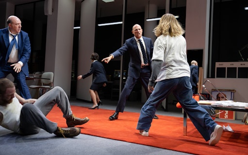 Actors performing a dramatic scene on stage at the Oedipus Broadway show.