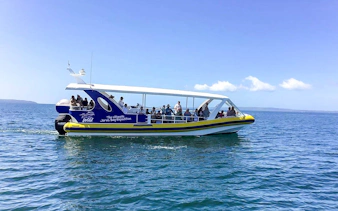 Jervis Bay Wild tour boat with guests on a whale watching expedition.
