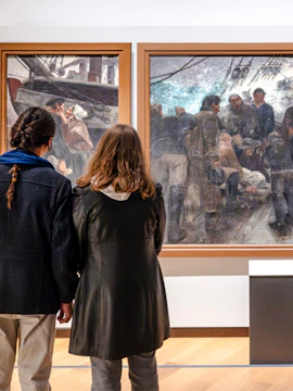 People viewing maritime paintings at National Marine Museum, Paris, France.