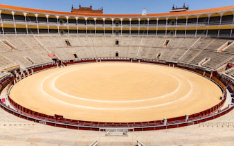 Las Ventas bullring in Madrid, Spain, showcasing the empty arena and surrounding seating.