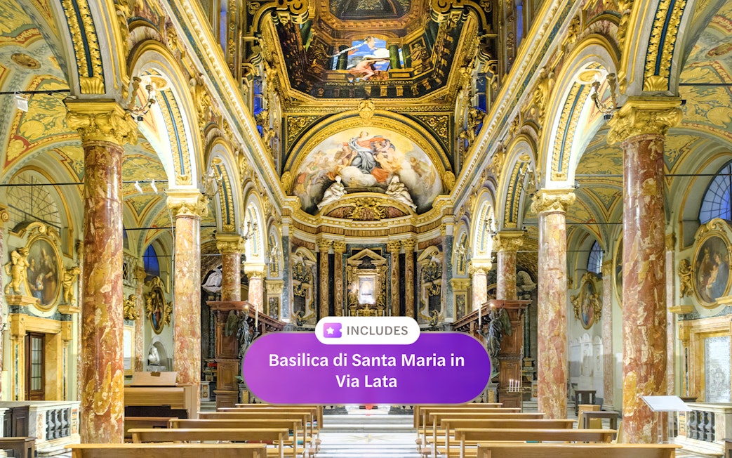 Interior of Santa Maria in Via Lata with ornate frescoes and marble columns, Rome.