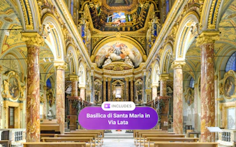 Interior of Santa Maria in Via Lata with ornate frescoes and marble columns, Rome.