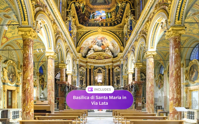 Interior of Santa Maria in Via Lata with ornate frescoes and marble columns, Rome.