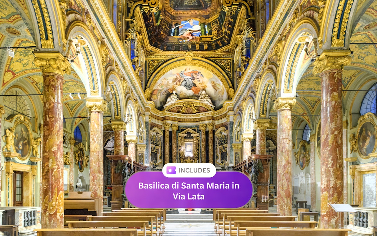 Interior of Santa Maria in Via Lata with ornate frescoes and marble columns, Rome.