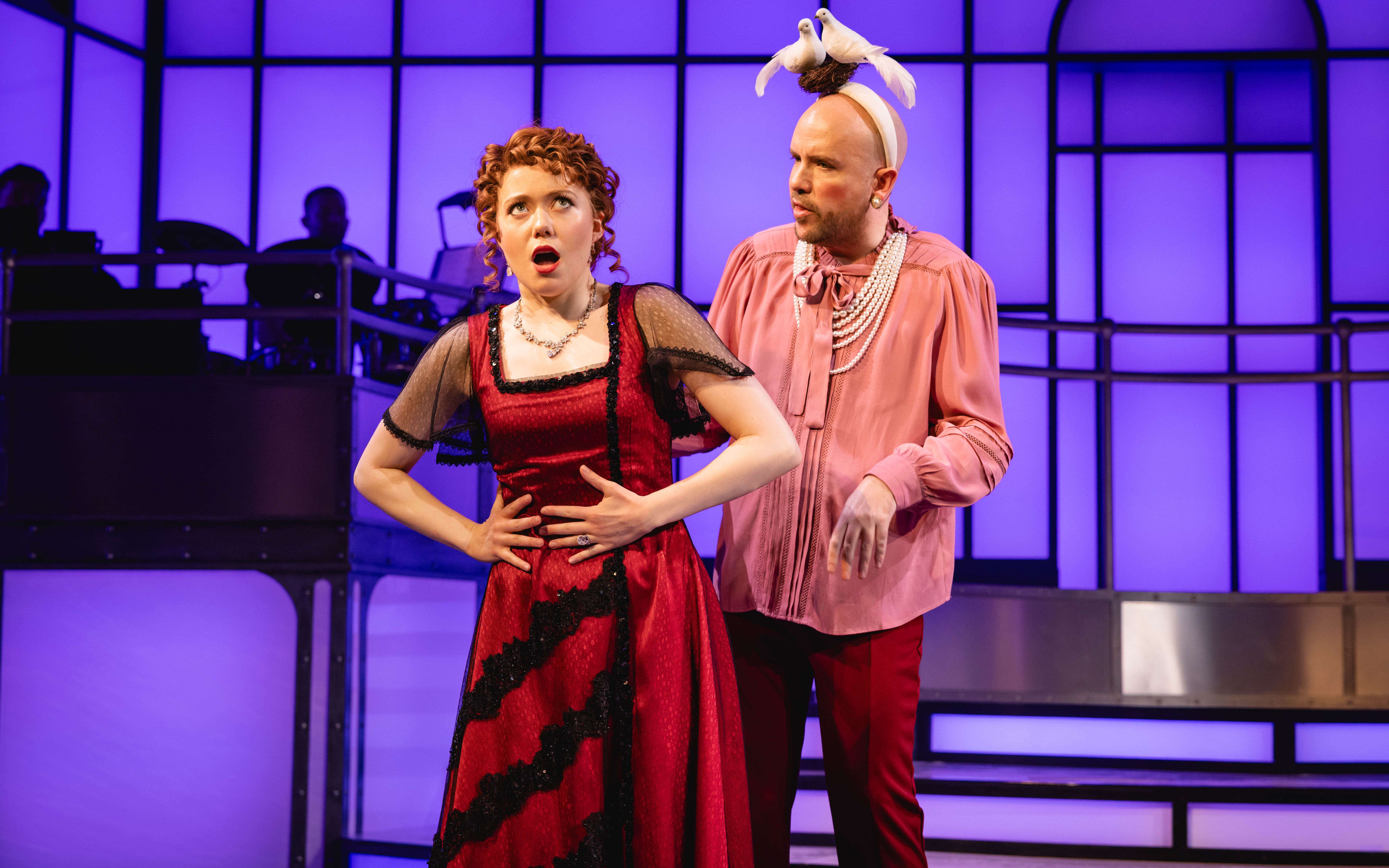 Actors performing a scene from Titanique Westend on stage.