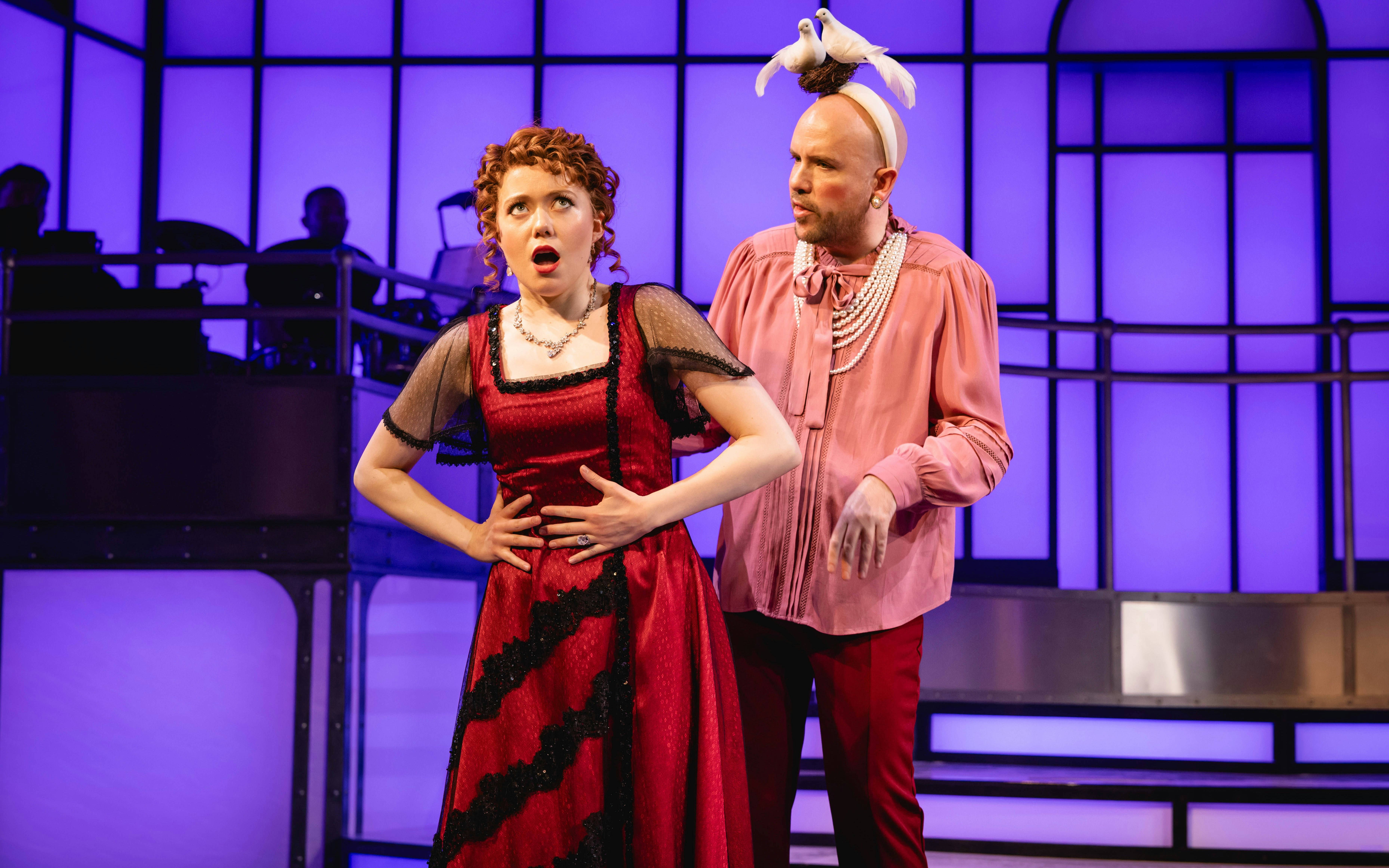 Actors performing a scene from Titanique Westend on stage.