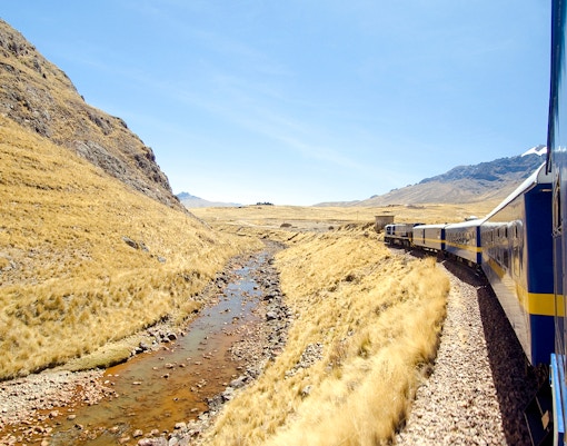 Train journey from Cusco to Machu Picchu, Peru, passing through scenic mountain landscape.