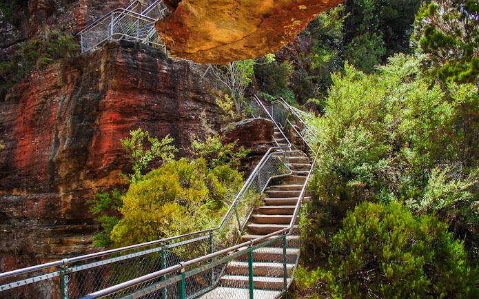 Staircase along a rocky cliff in Blue Mountains National Park, Australia.