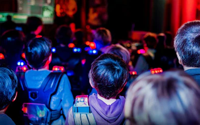 Participants in laser tag gear at Lasergame Rotterdam.