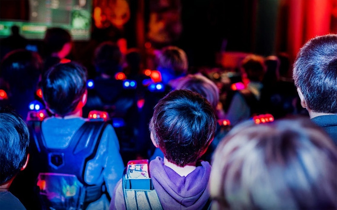 Participants in laser tag gear at Lasergame Rotterdam.