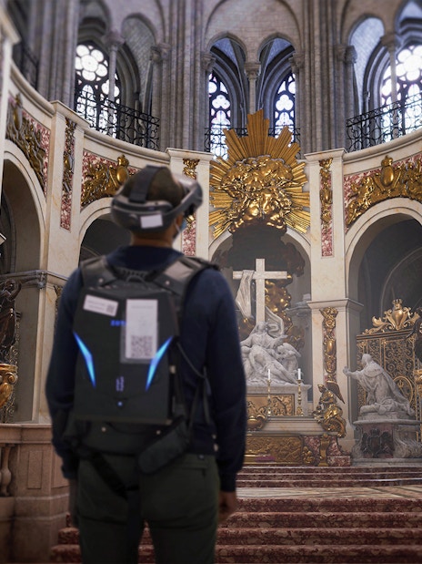 Visitors experiencing Notre-Dame Cathedral in virtual reality, Paris, highlighting historical architecture.