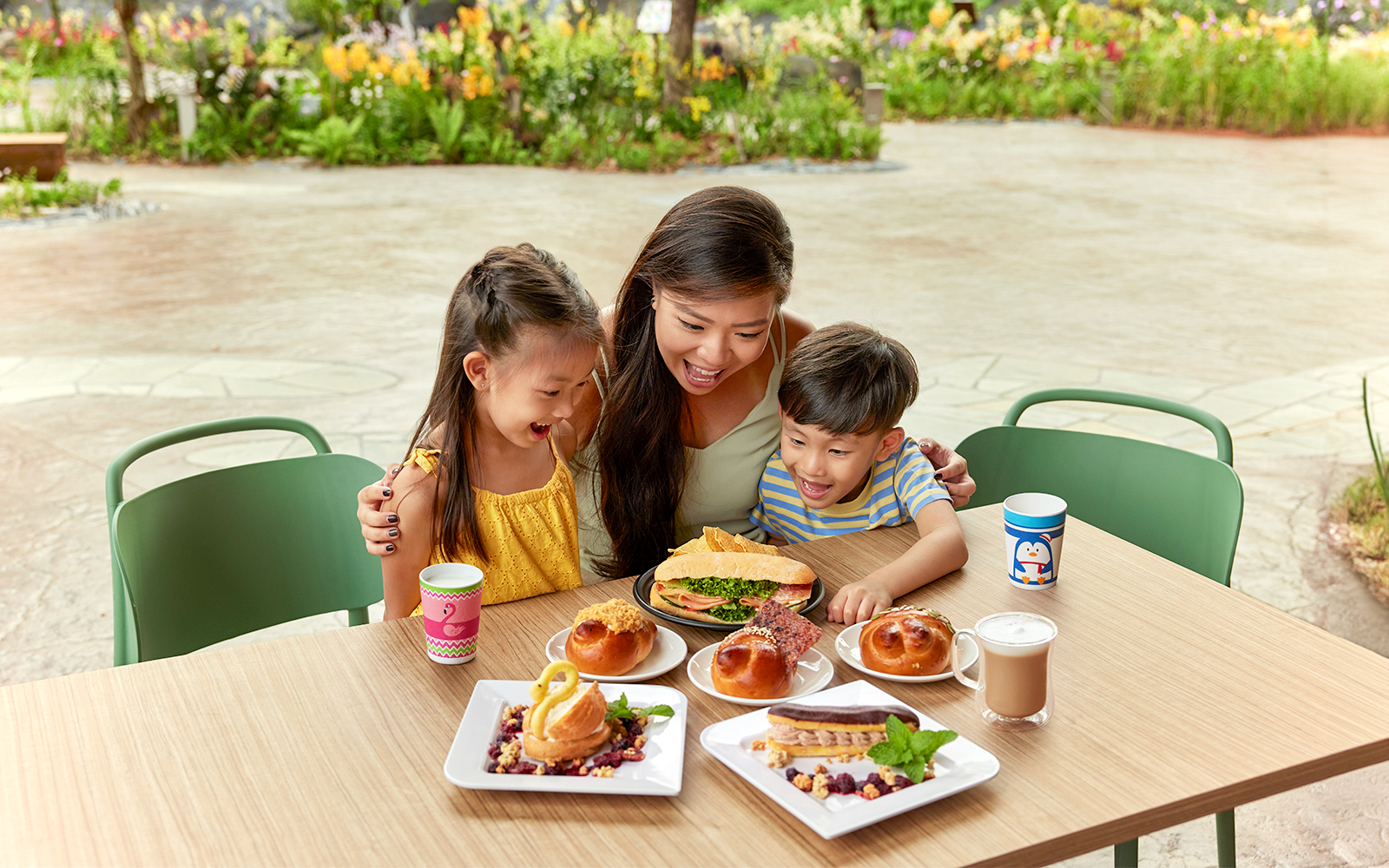 Family enjoying pastries and drinks at Bird Paradise café during VIP Walking Tour.