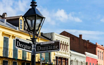 Decatur and Dumaine street signs in New Orleans, part of the Phantom Ballerina city exploration game.