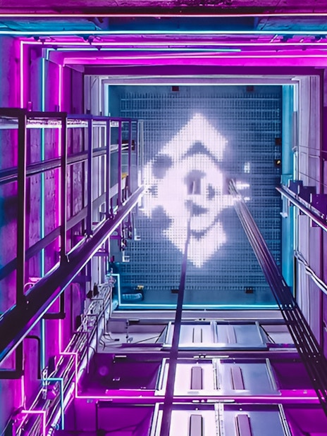 View from inside the A'DAM LOOKOUT elevator with vibrant neon lights.
