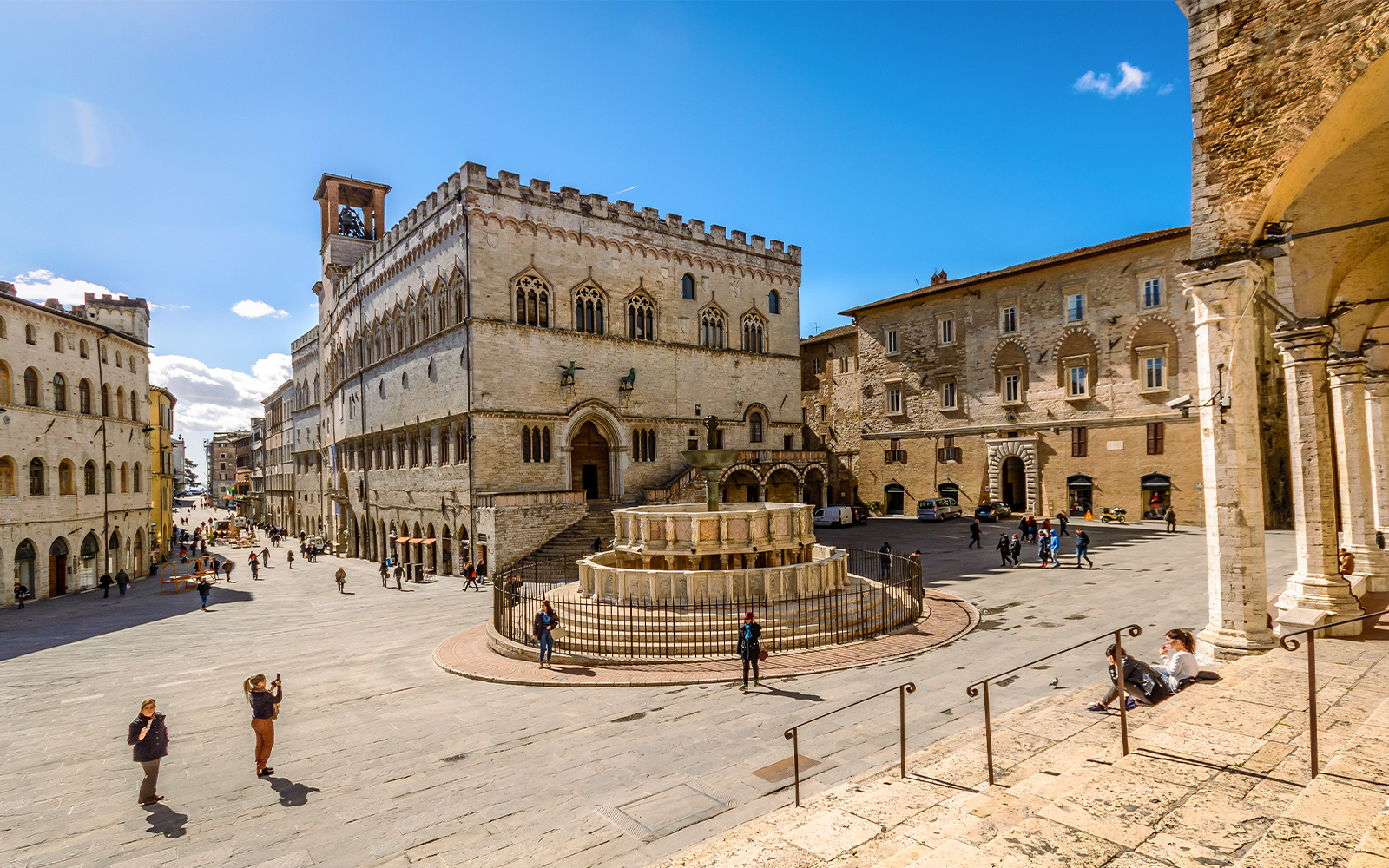 Perugia cityscape with historic buildings and lush greenery in Italy.
