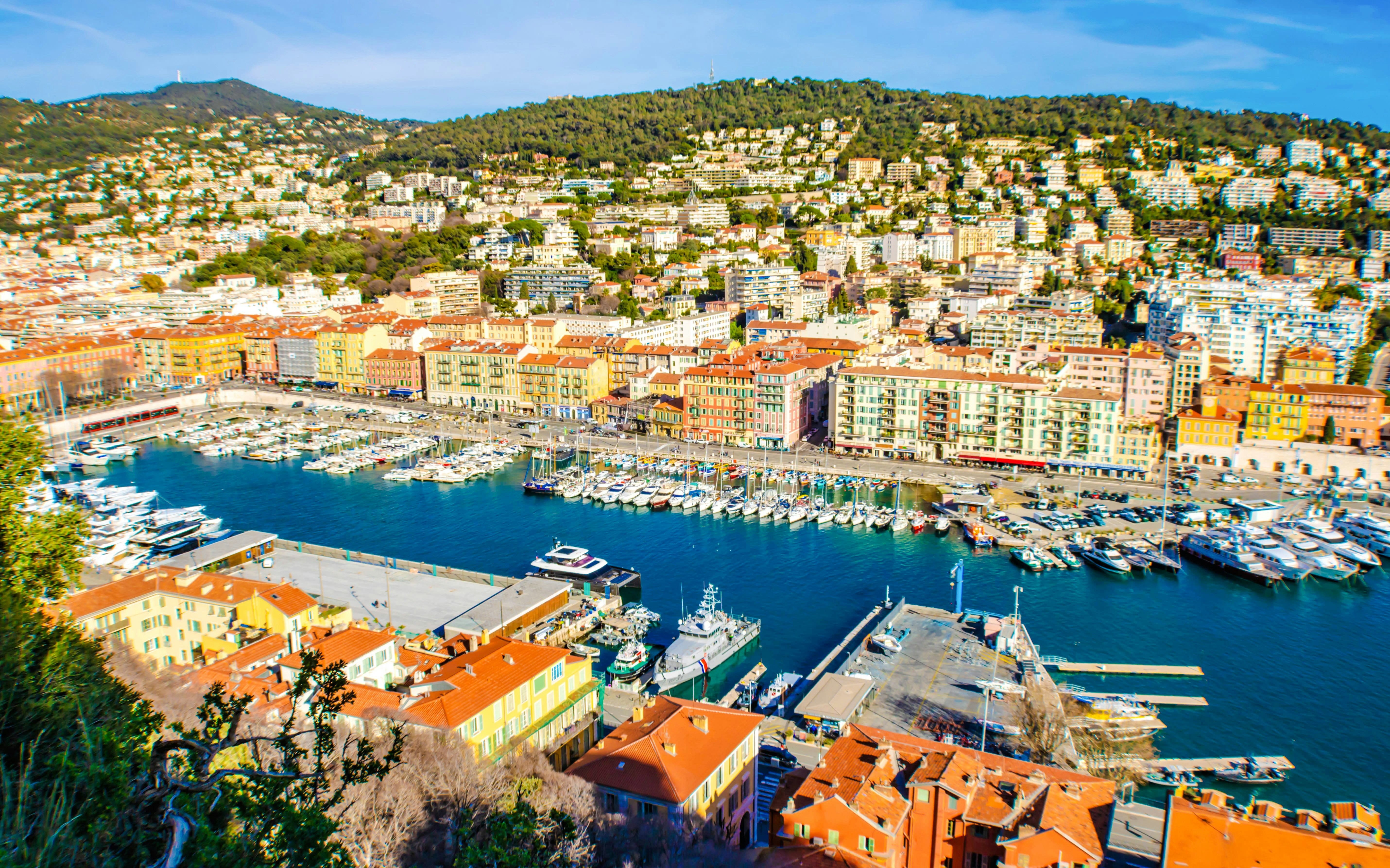 Harbor view of Nice with colorful buildings and yachts, French Riviera.