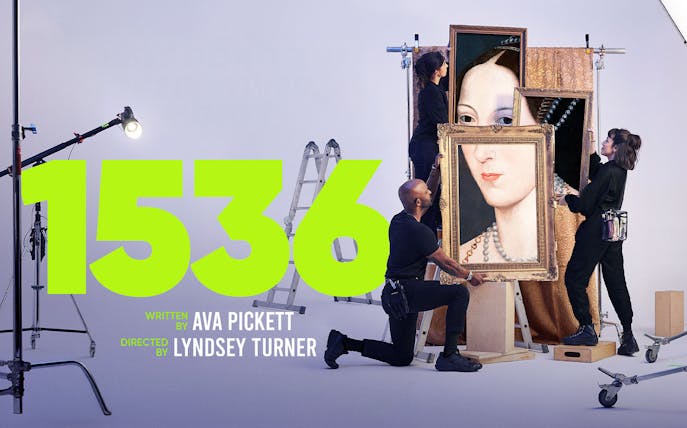 West End show "1536" production setup with crew handling a large portrait.