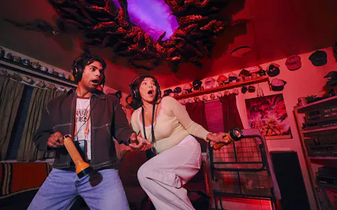 Guests playing Stranger Things games at Netflix House, Philadelphia.