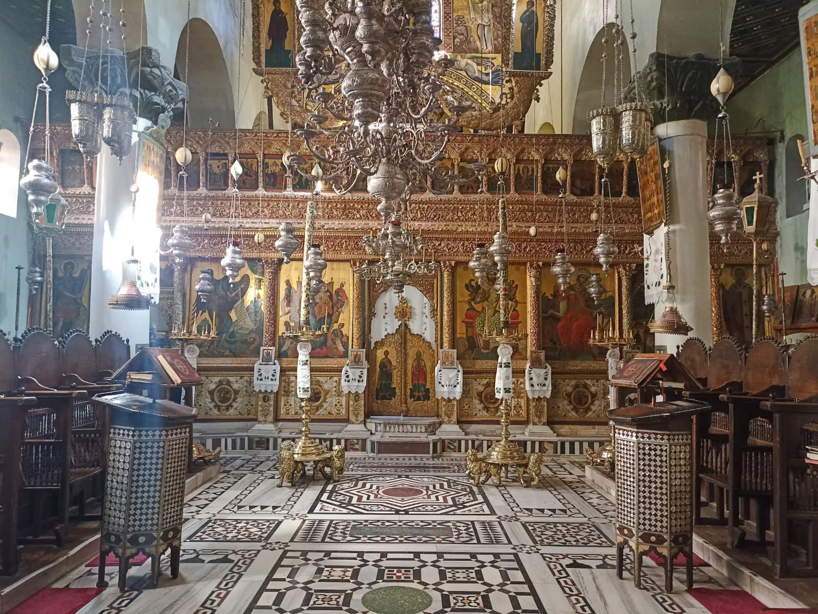 Interior of St Catherine Monastery with ornate chandeliers and religious icons, Sharm el-Sheikh.