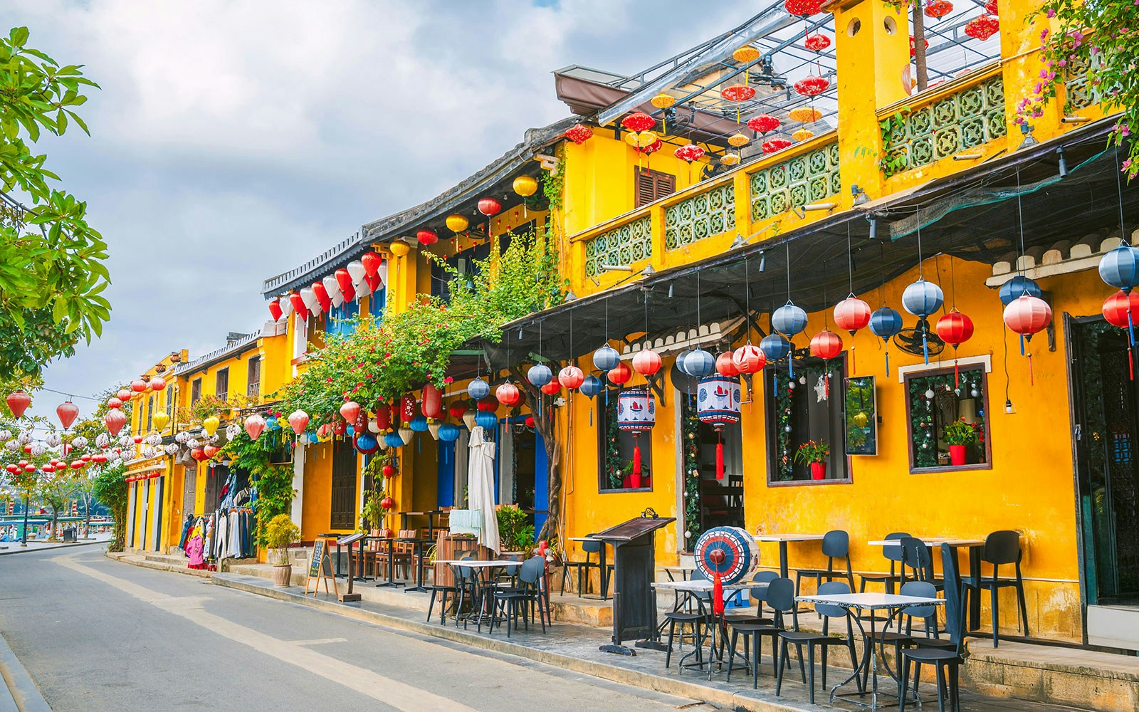 Hoi An's old yellow houses with colorful lanterns and street cafes.