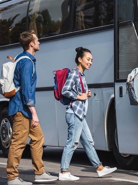 Tourists boarding bus for transfers to Astérix Parc.