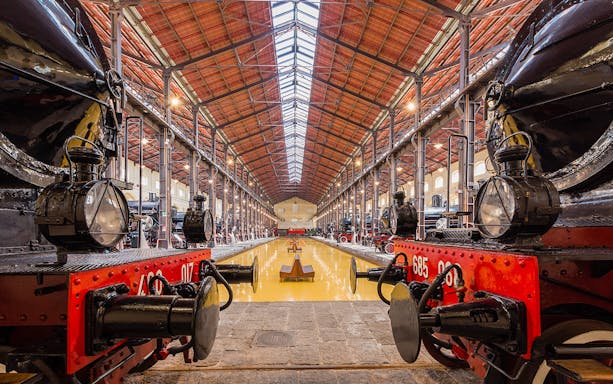 Pietrarsa Railway Museum interior with historic trains, Naples tour.