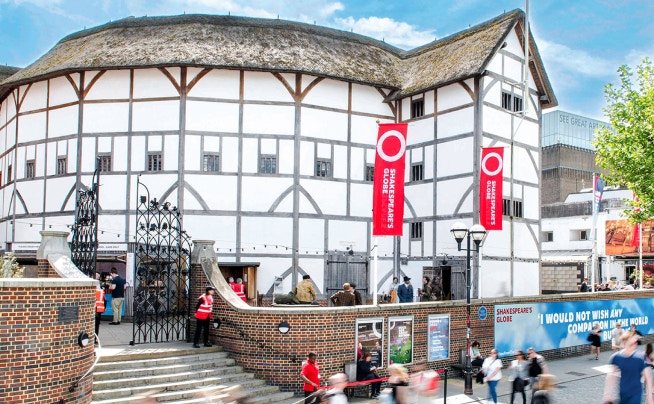Shakespeare's Globe Theatre exterior with visitors in London.