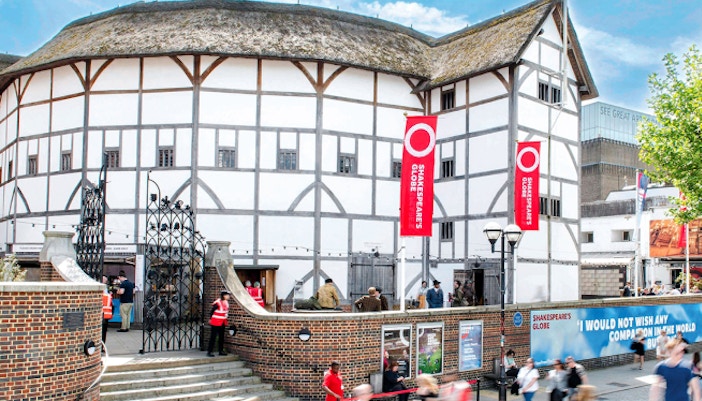 Shakespeare's Globe Theatre exterior with visitors in London.