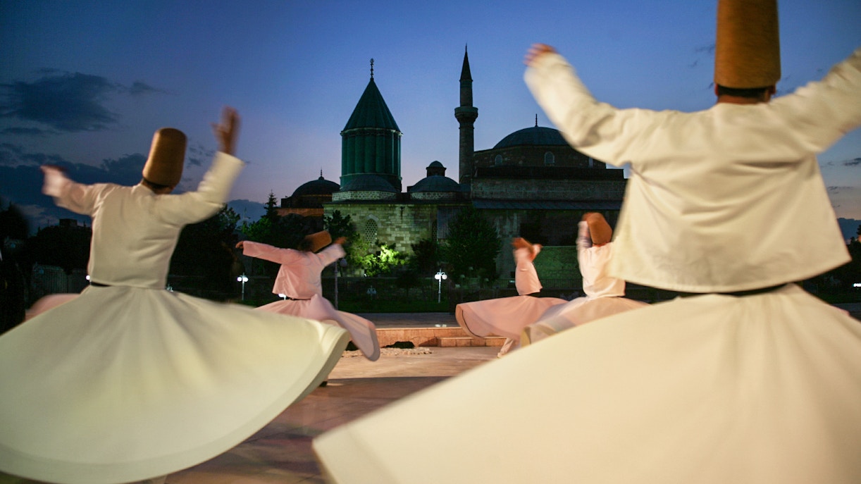 dervish dancer performing in front of mevlana museum
