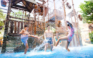 Children playing in water at Adventure Cove Waterpark, Singapore.