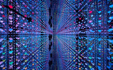 Colorful light installation with reflections at Moco Amsterdam.