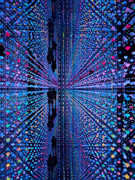 Colorful light installation with reflections at Moco Amsterdam.