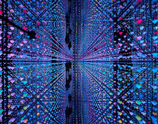 Colorful light installation with reflections at Moco Amsterdam.