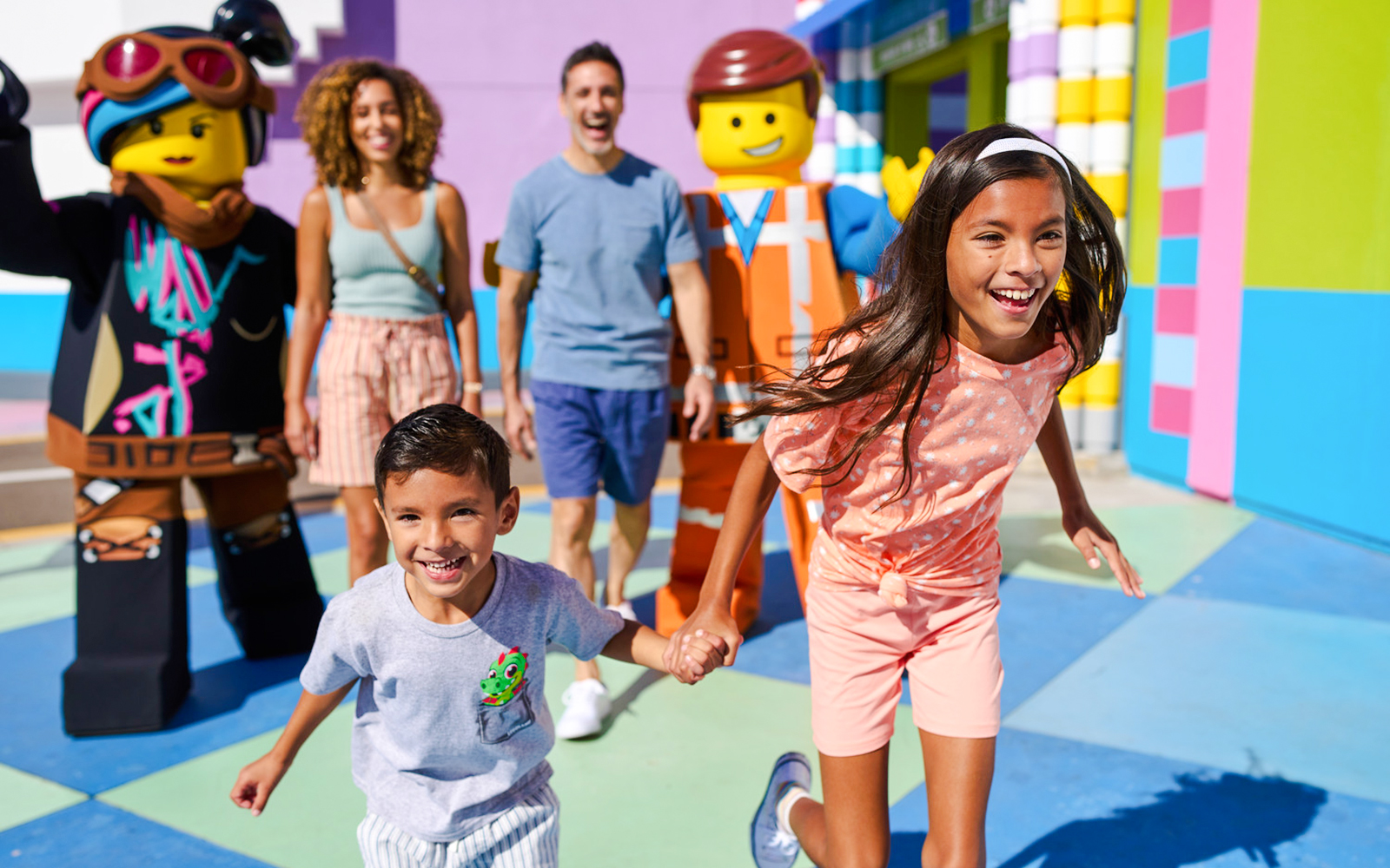 Family enjoying time with LEGO characters at LEGOLAND® California.
